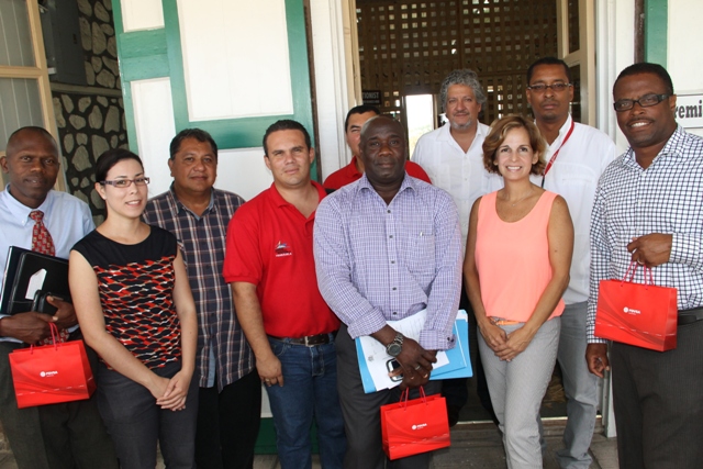General Manager POV St. Kitts Nevis Ltd. Maria Andreina Colmenores (front row, second from right) and other members of the Venezuelan delegation led by resident Venezuelan Ambassador to St. Kitts and Nevis His Excellency Ròmulo Henriquez Gonzàlez (back row, third from right) with Acting Premier of Nevis Hon Mark Brantley (extreme right), Minister responsible for Renewable Energy Hon. Alexis Jeffers ( front row, second from left), Acting General Manager of the Nevis Electricity Company Ltd. Jervan Swanston (extreme left) at the Nevis Island Administration office, Bath Hotel on June 04, 2015